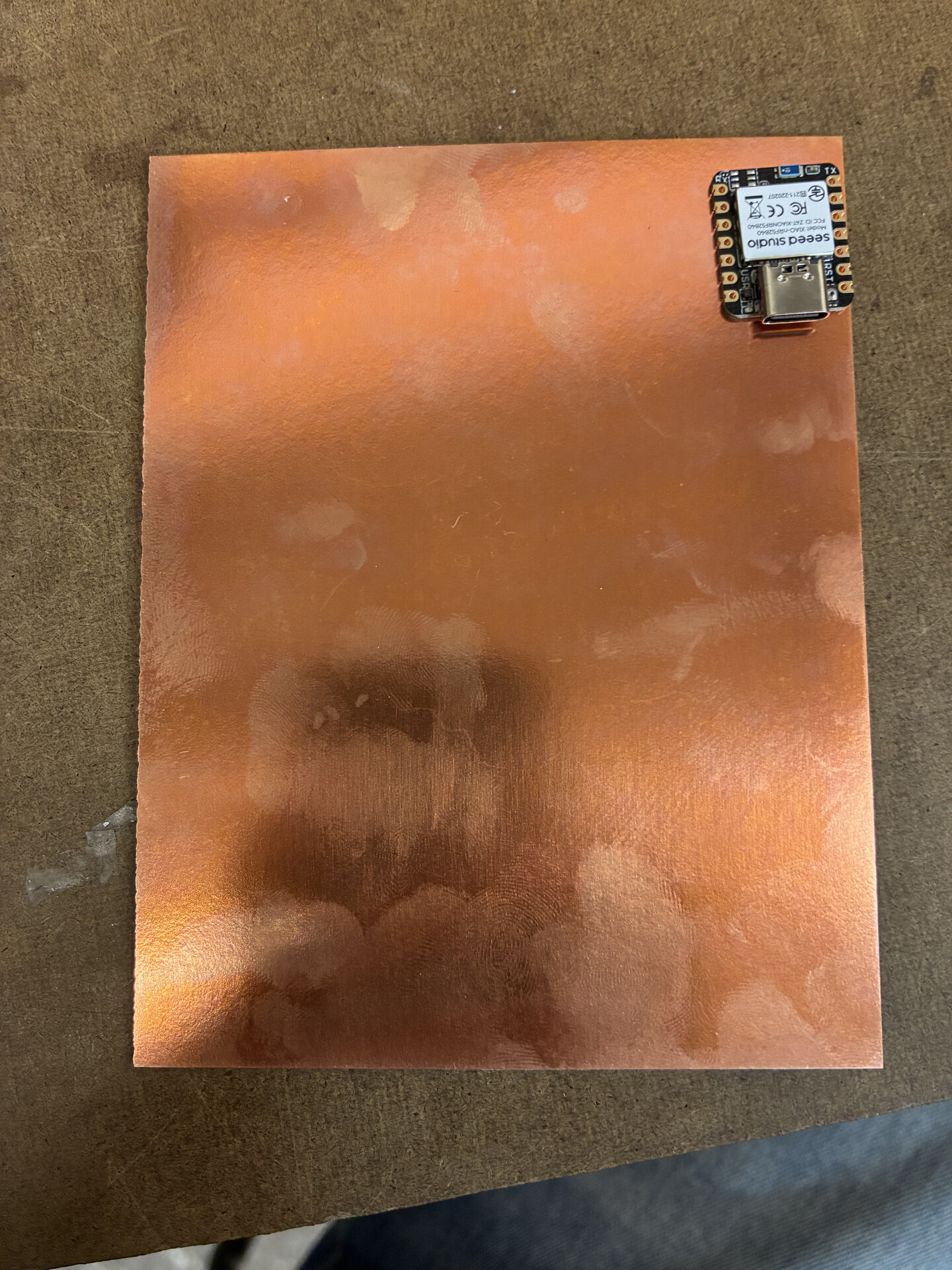 Physically laying out my components on the one sided copper PCB board to design sizing and distance. In addition to design rules (track width, distance, etc) Gert told me it is important to consider aspects of functionality such as if my ports are accessible, my wires are relieved of tensions, and so on.